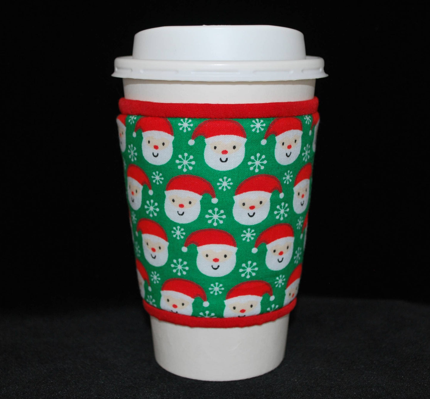 Cup Cozee - Small, Smiling Santa Heads On Green